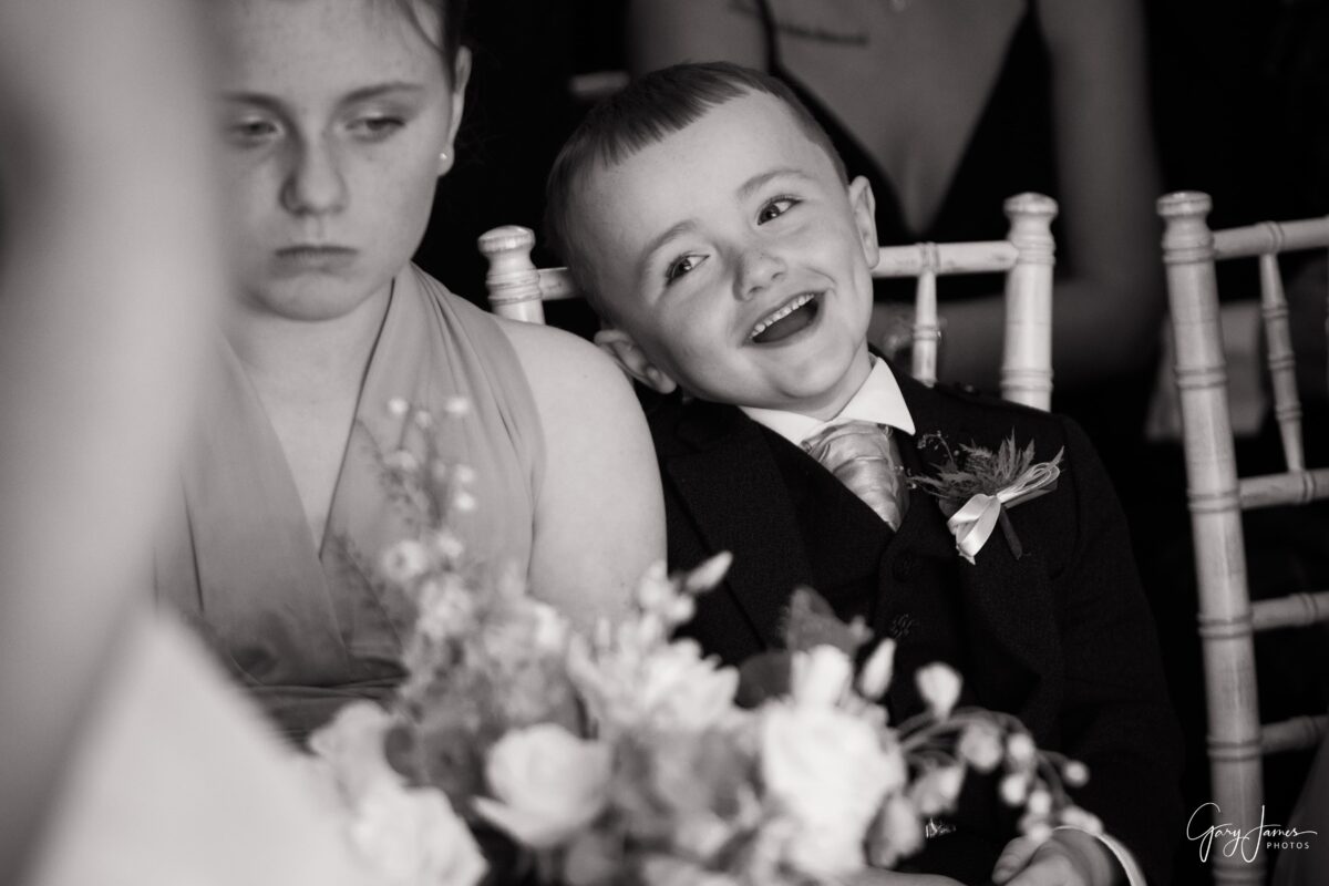 A natural moment captured at his mum and dad's wedding