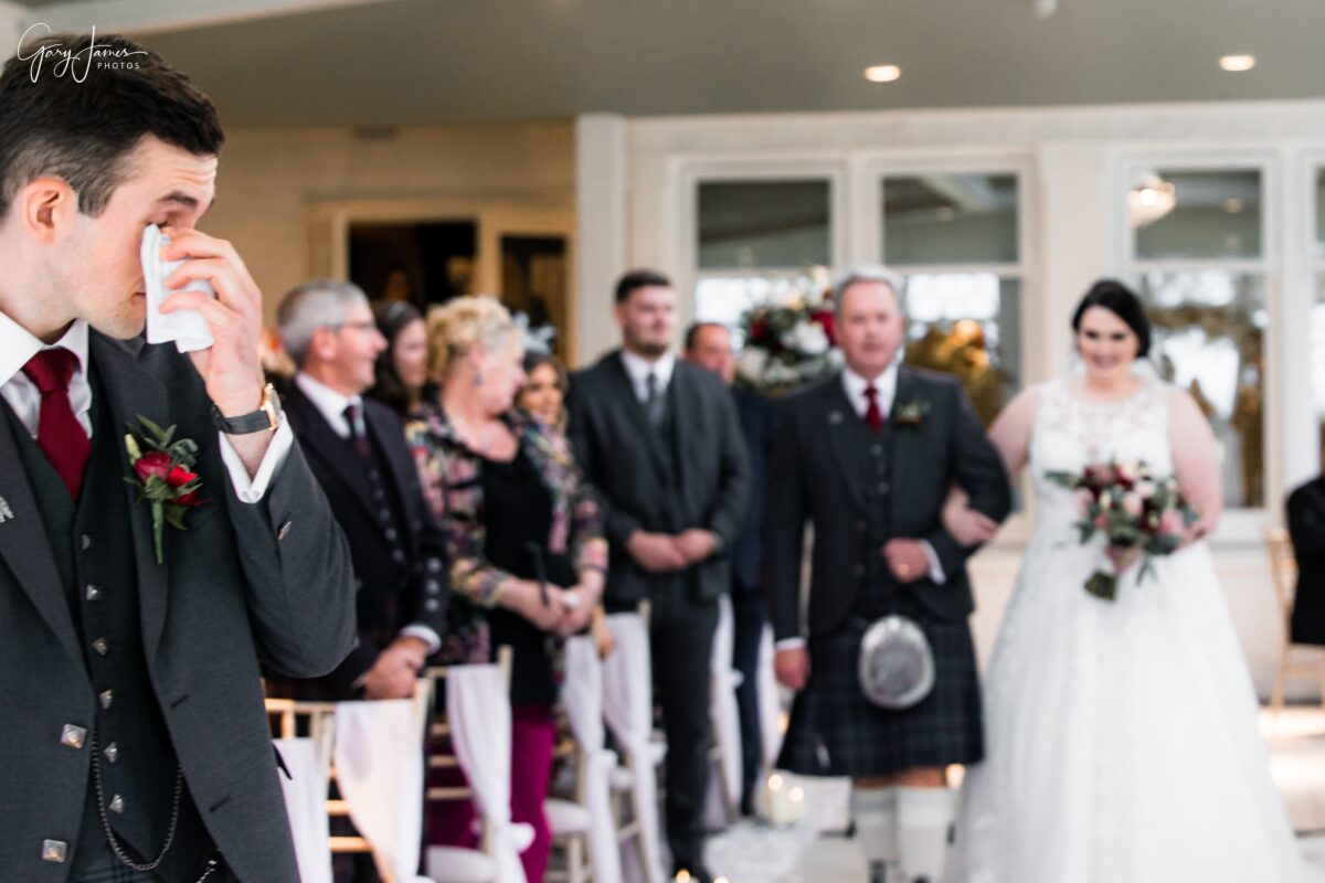 A special moment for the groom at his Wedding at Lochgreen House
